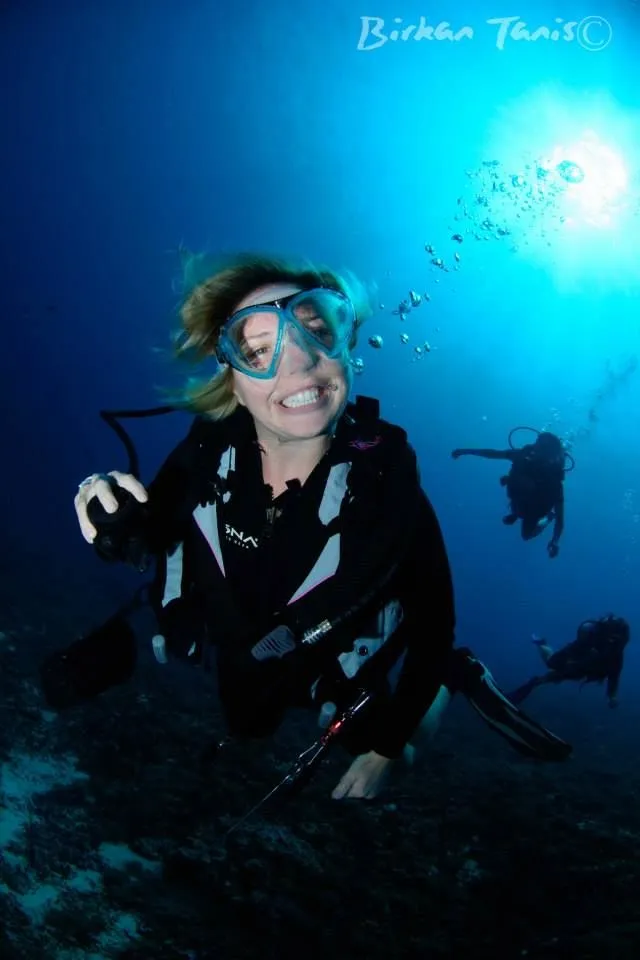 Diver photographer with sunburst