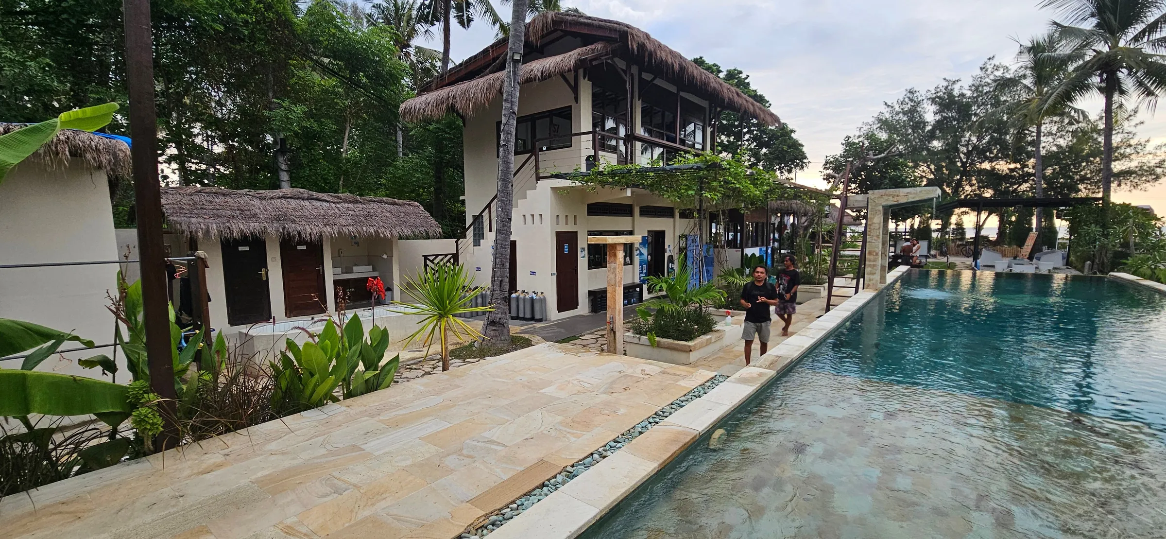Pool with tanks lined along it