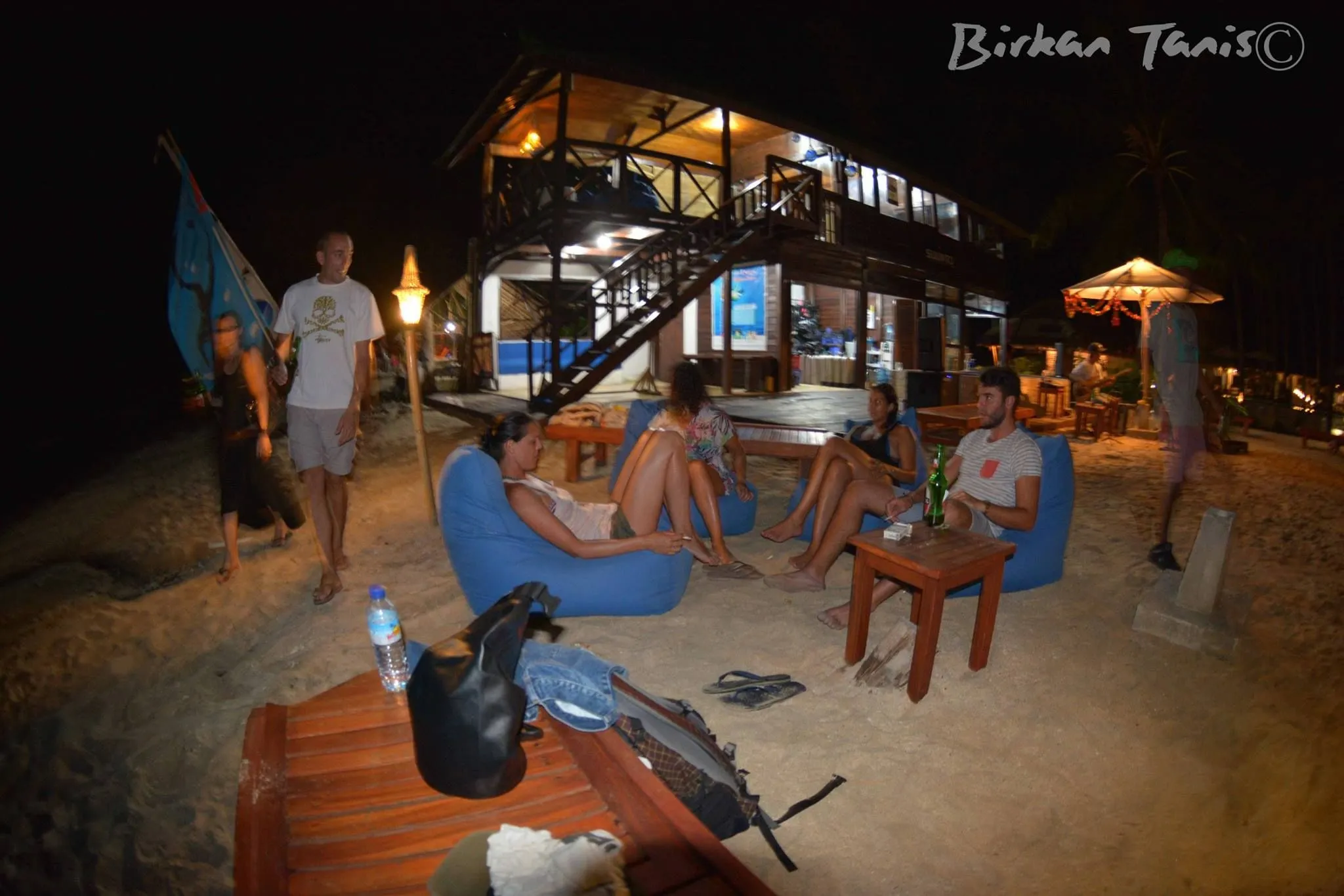 Diners at the beachside bar