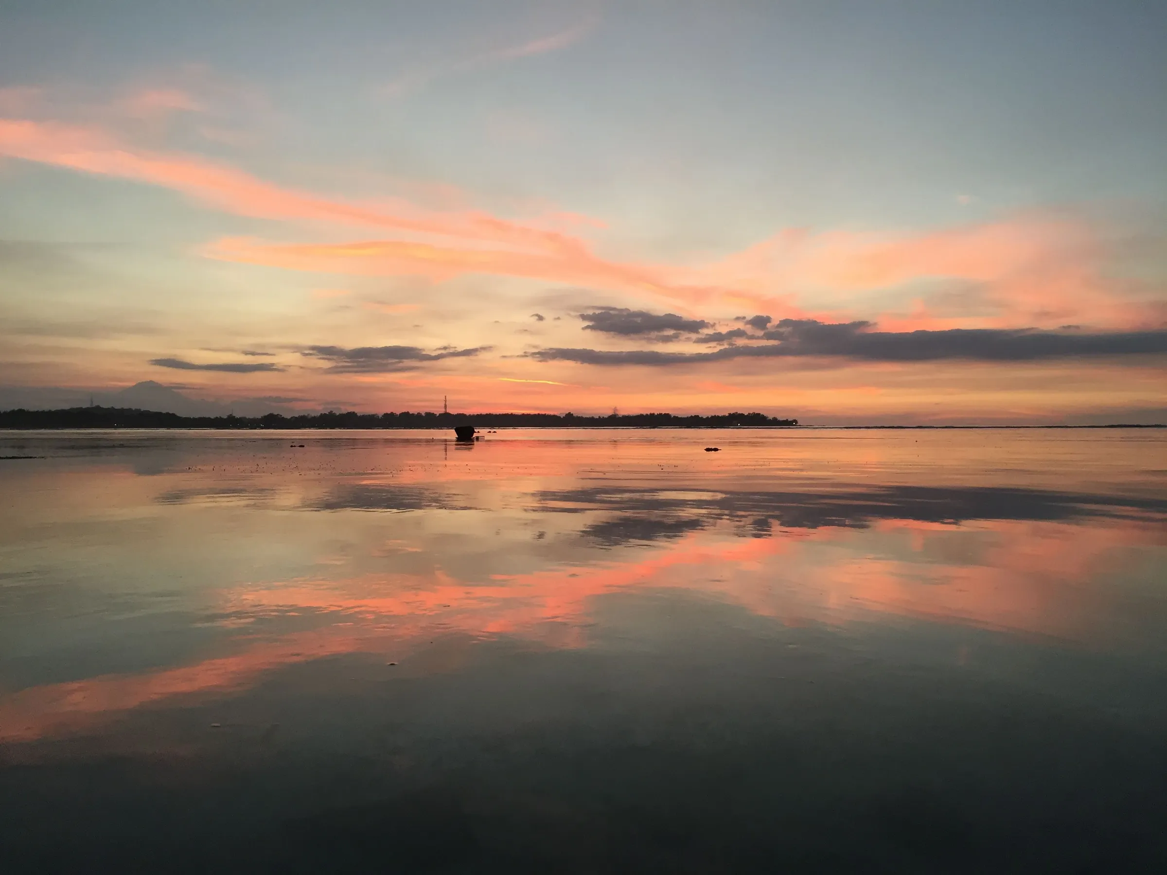 Sunset reflection on calm sea
