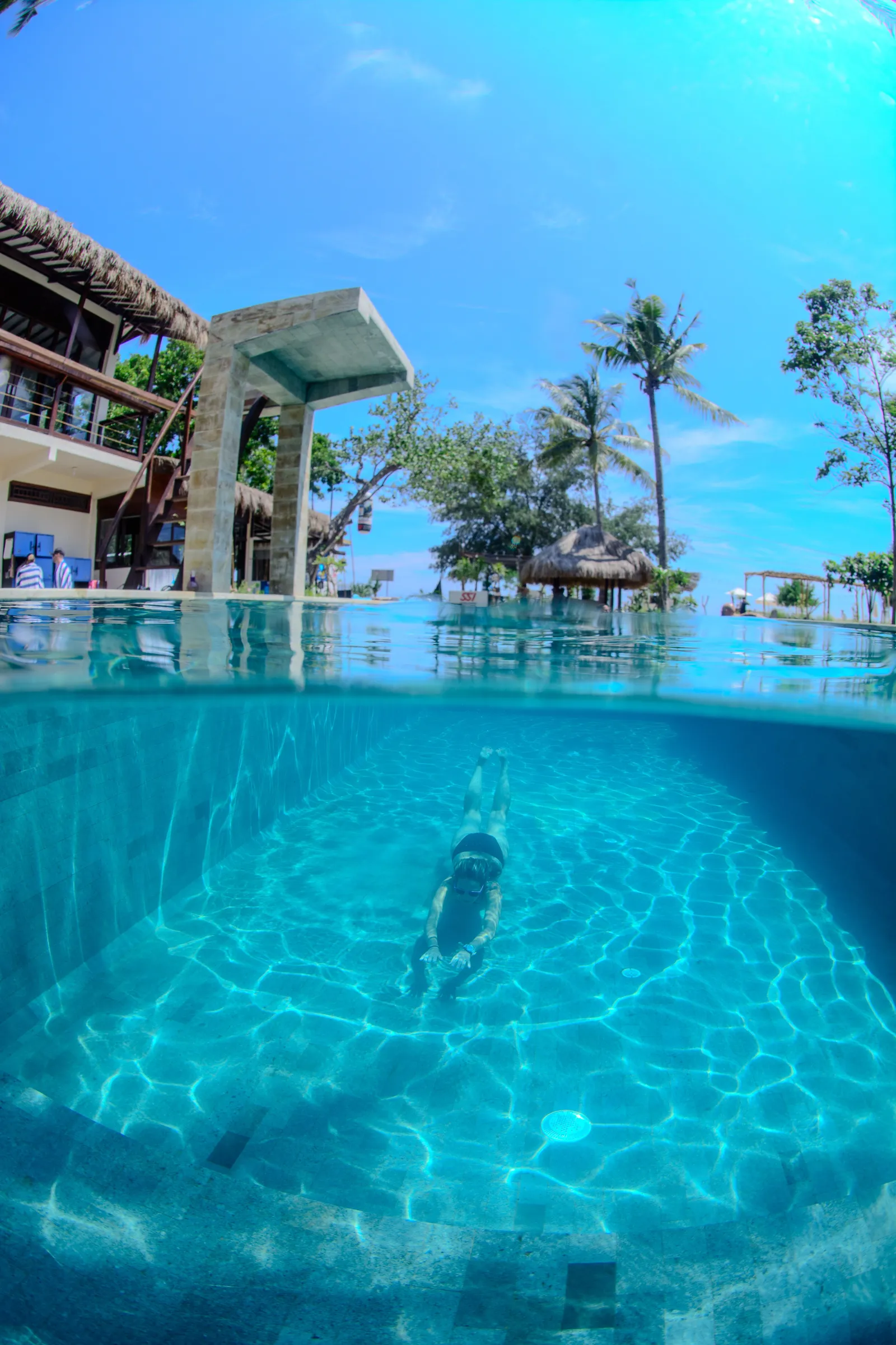 Split-shot of resort and pool
