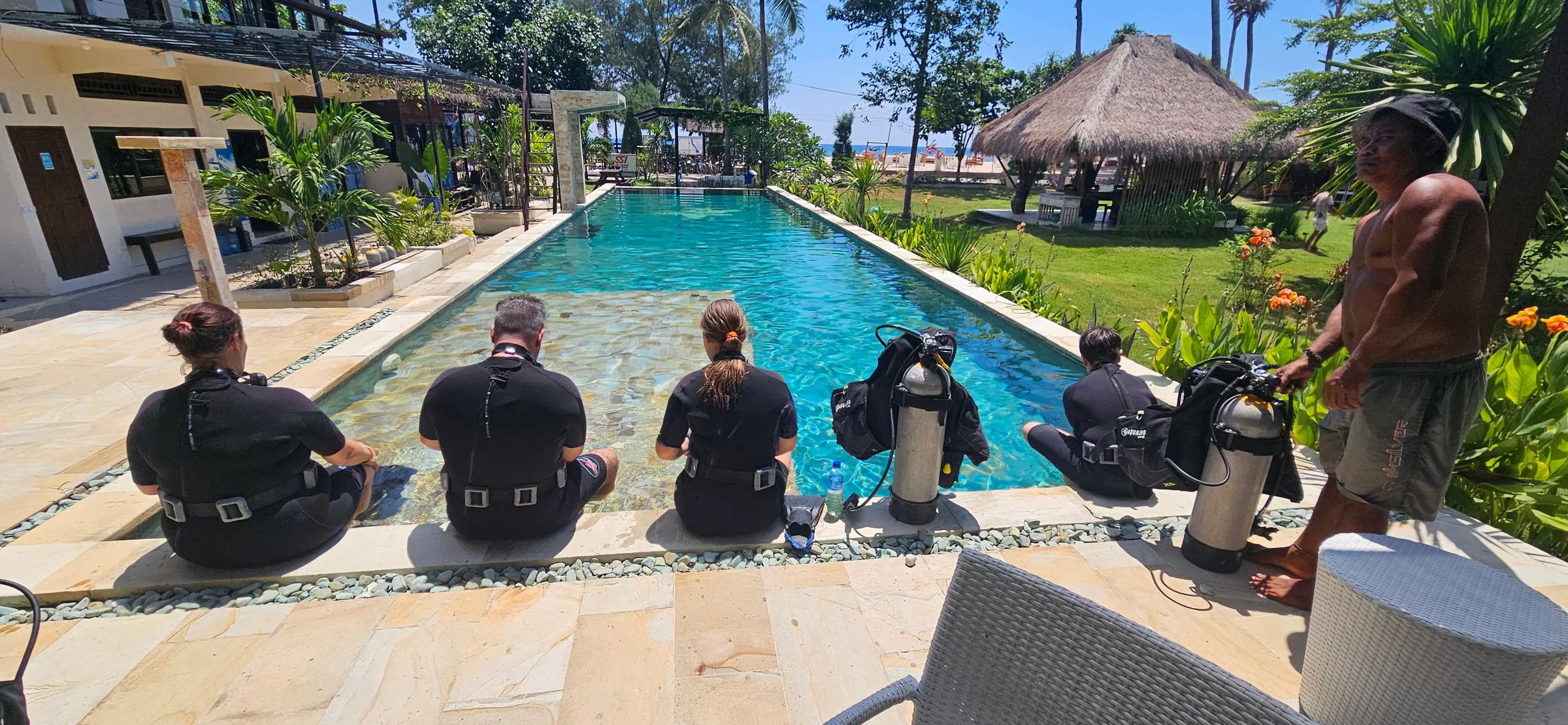 Diving student preparing poolside