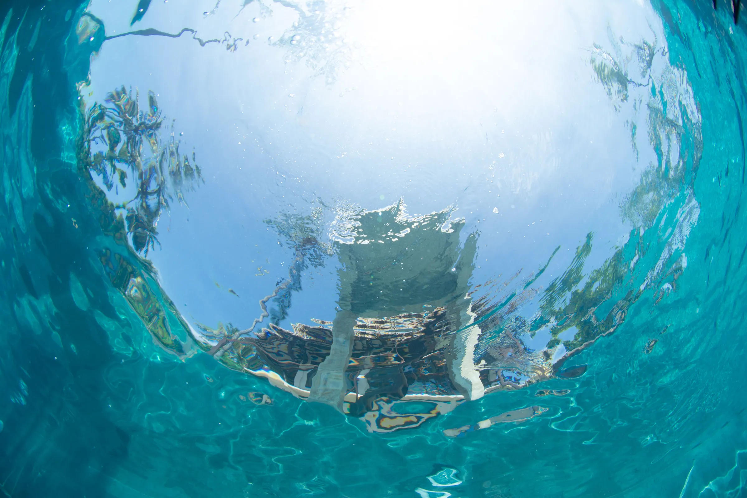 Diver kneeling at pool bottom
