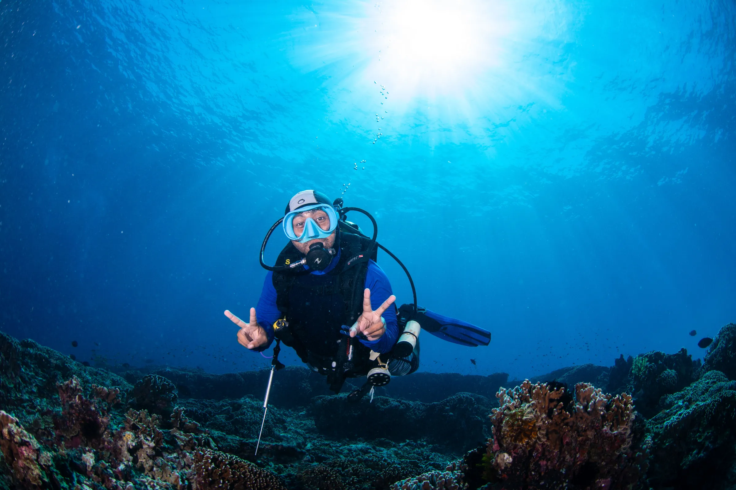 Diver giving thumbs up underwater