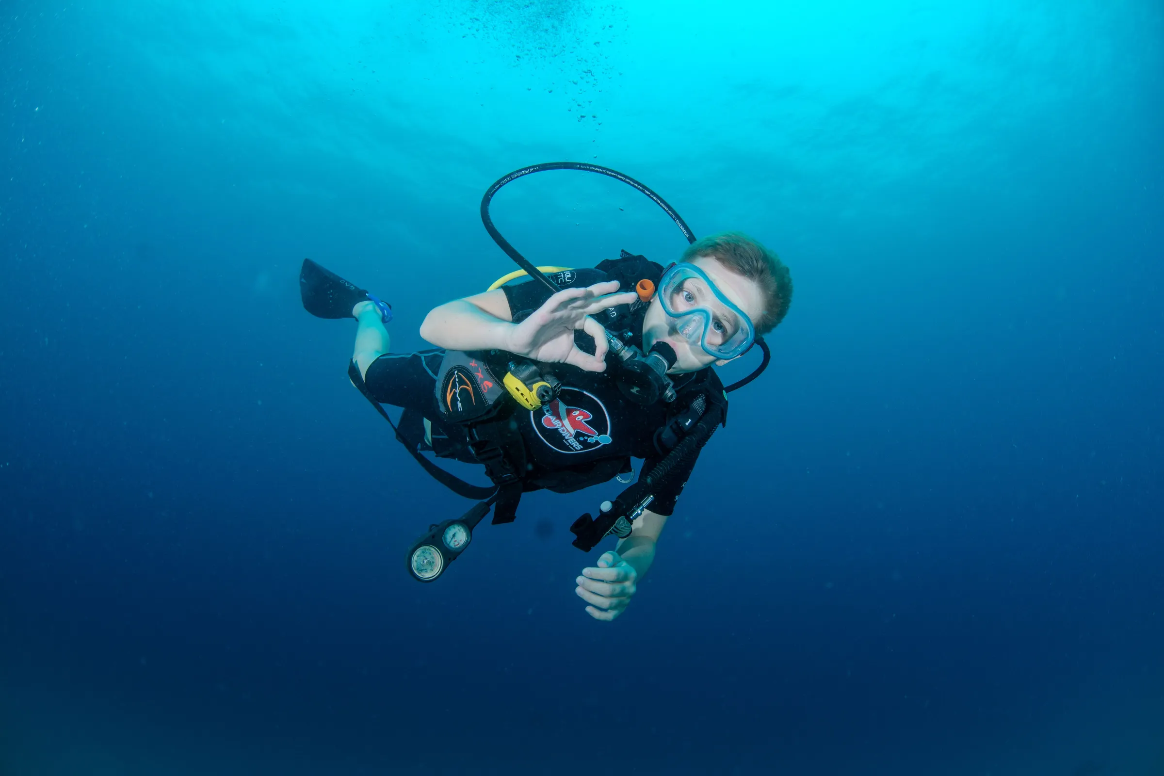 Buddy team smiling on the reef