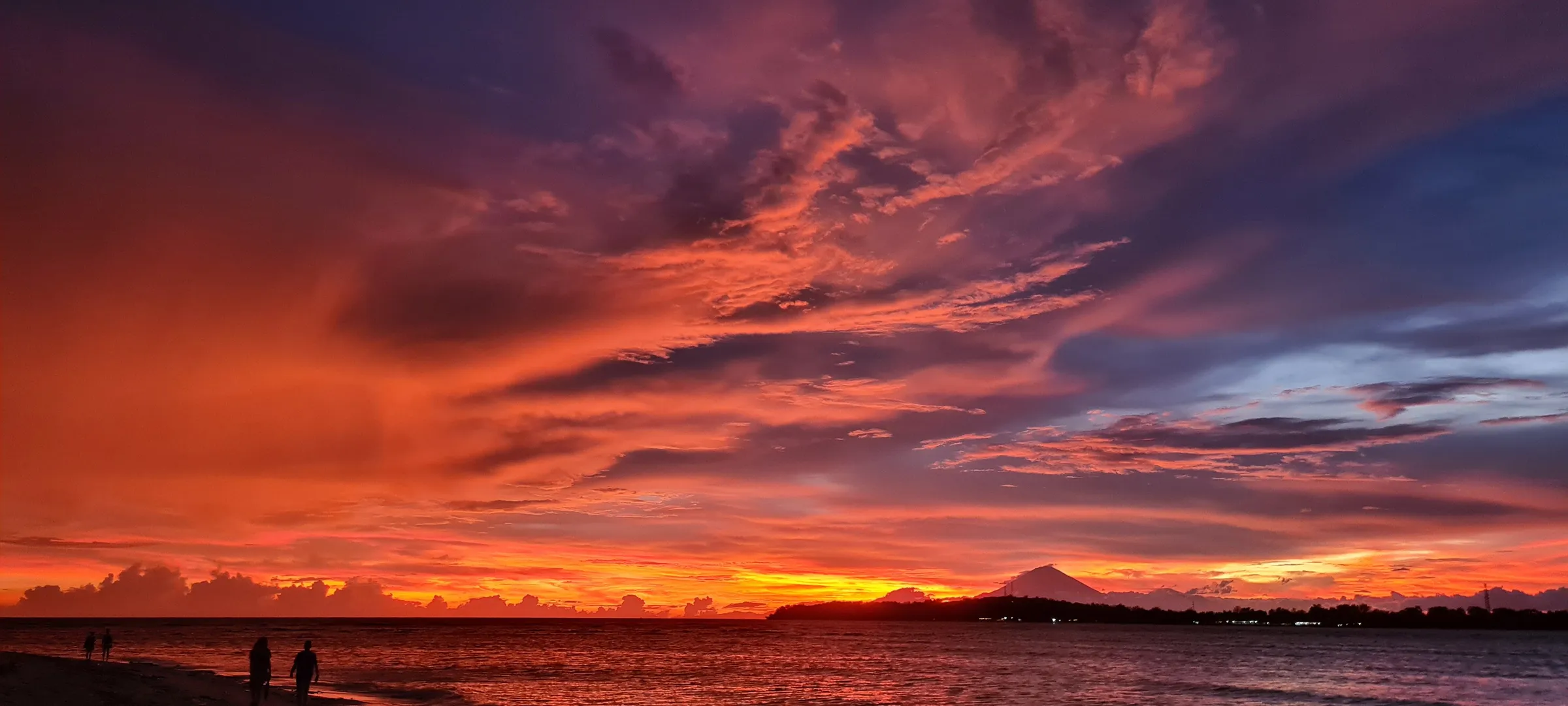 Pink sunset clouds over horizon