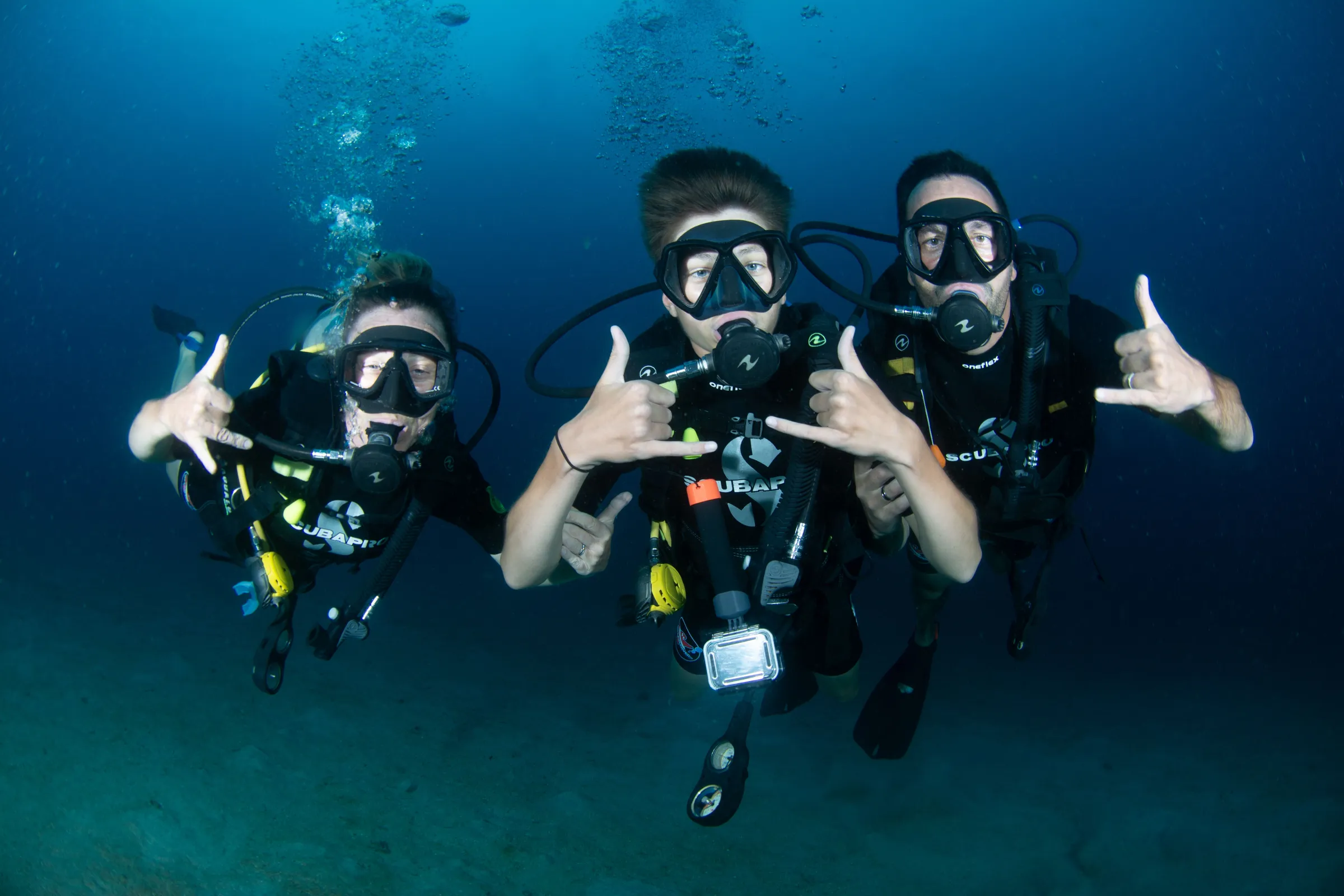Two divers giving thumbs up