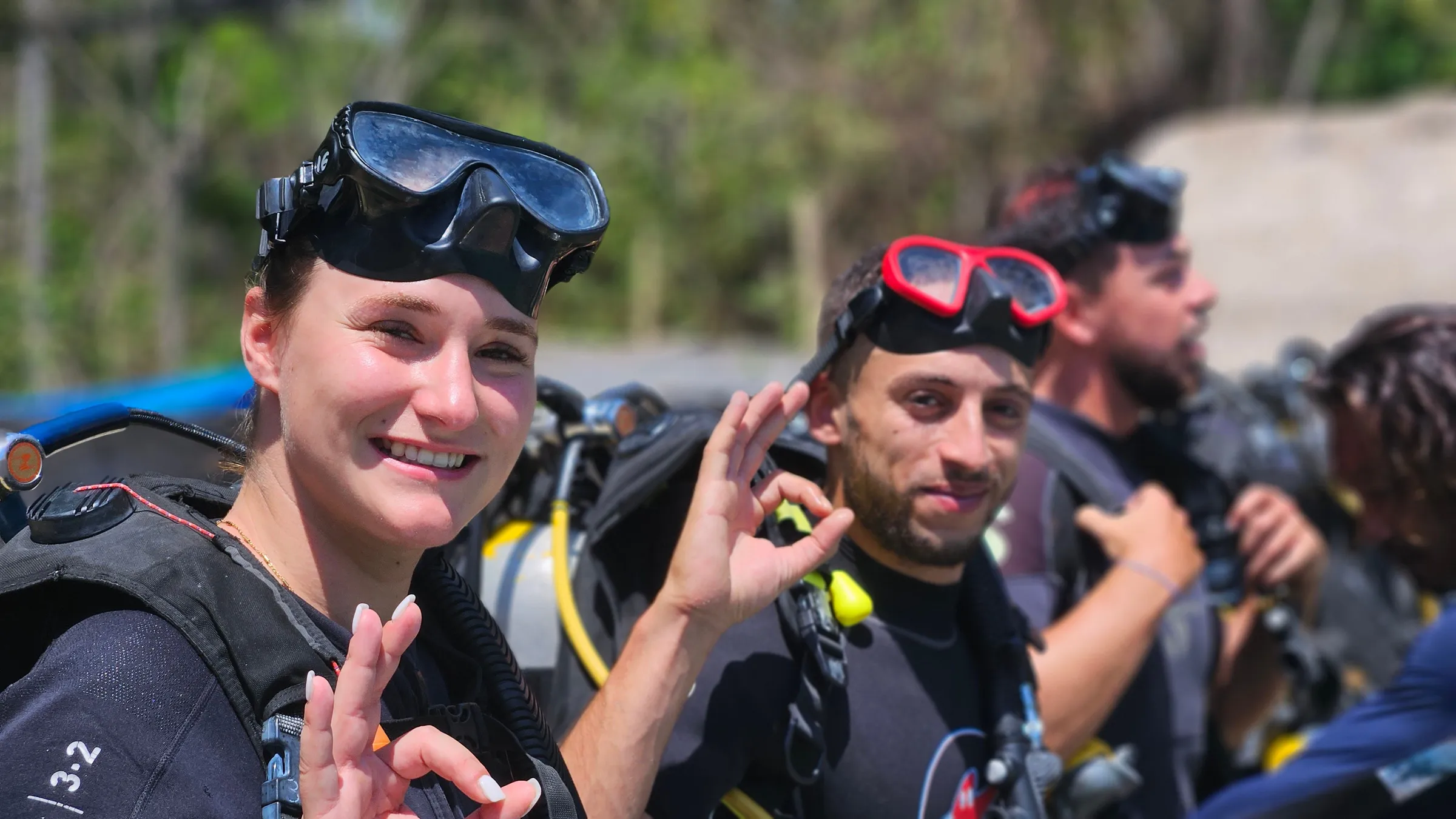 Smiling diver giving OK in pool