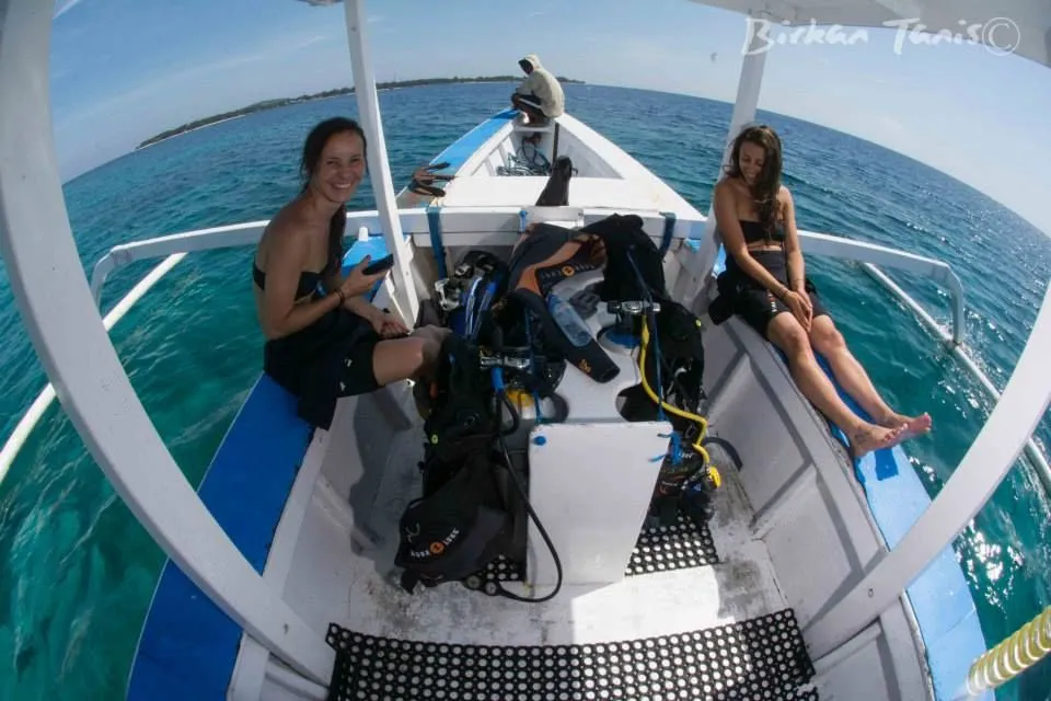 Group on boat with gear ready