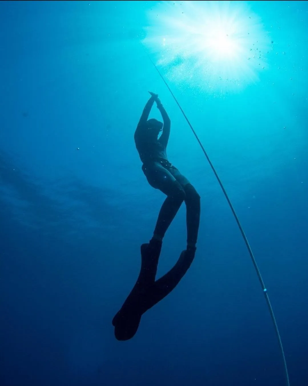 Freediver descending the line