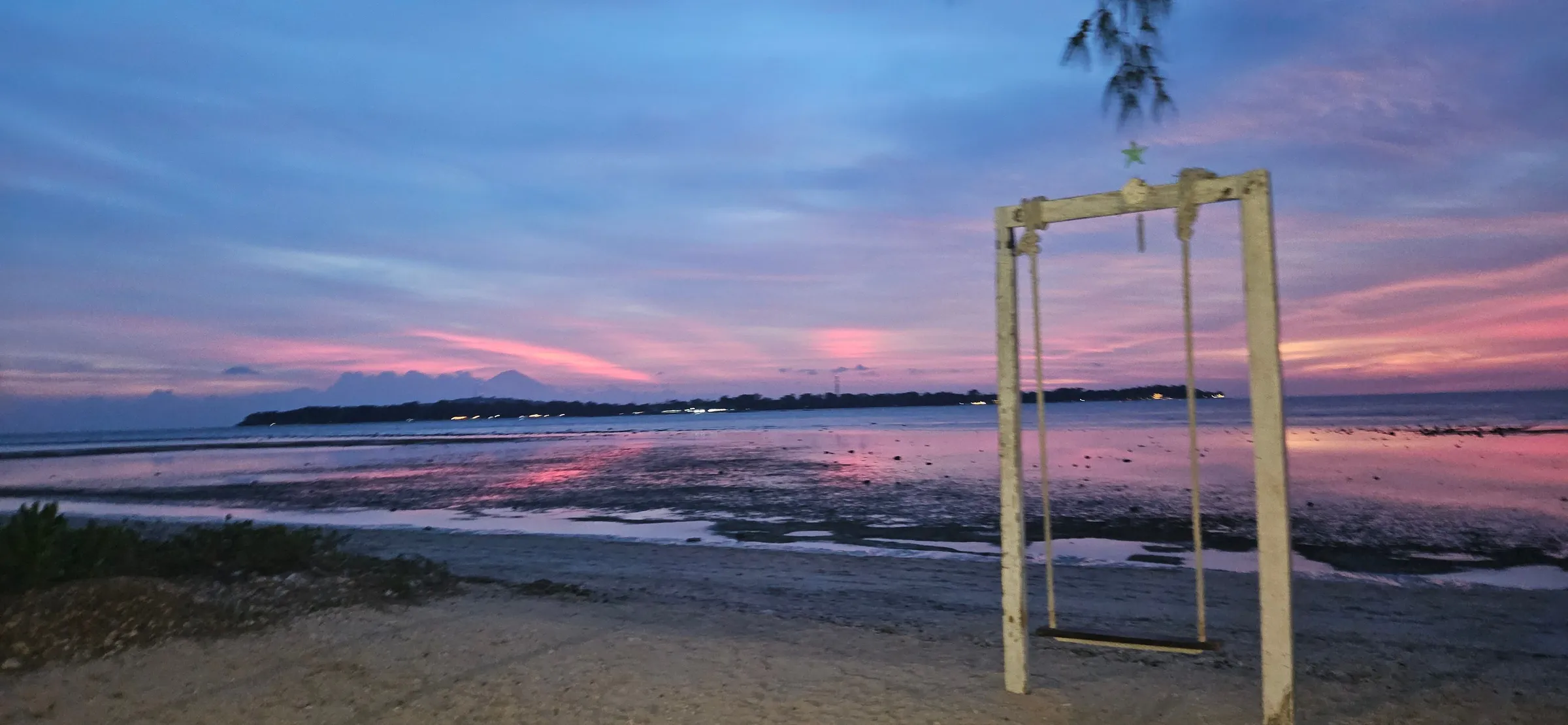 Beach swing at sunset