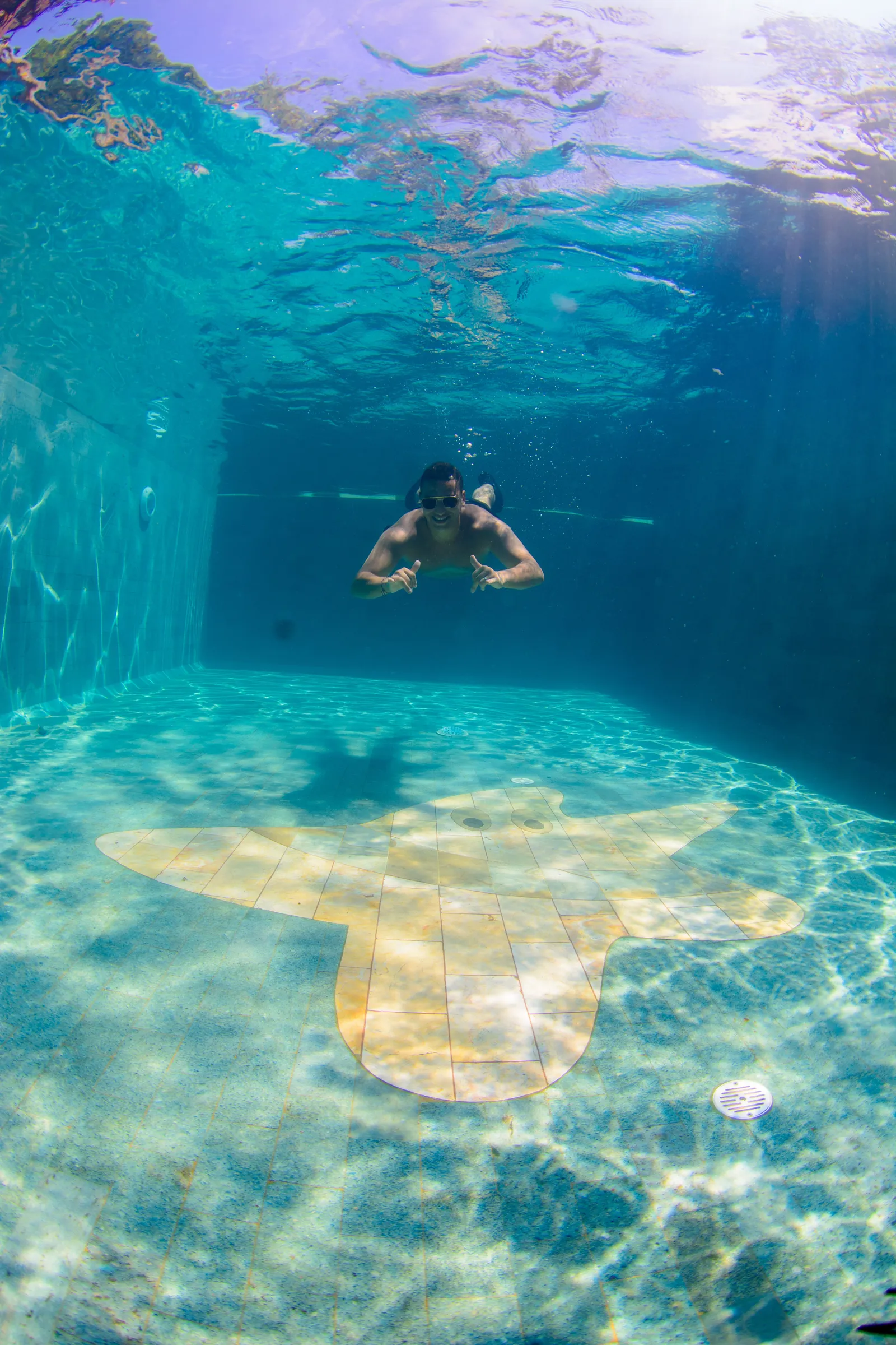 Snorkeler floating in the pool